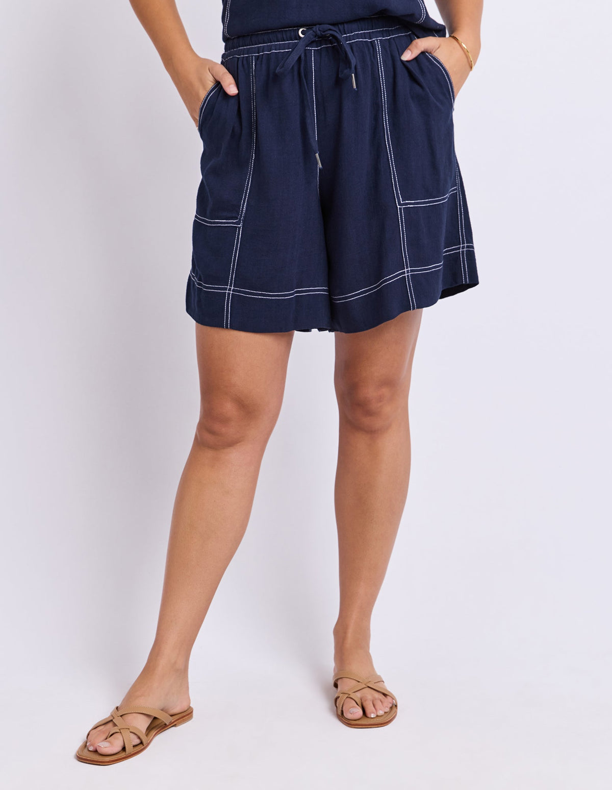Image of a model wearing Shorts. Product name - Sage Short Navy in Navy colour by brand - Foxwood