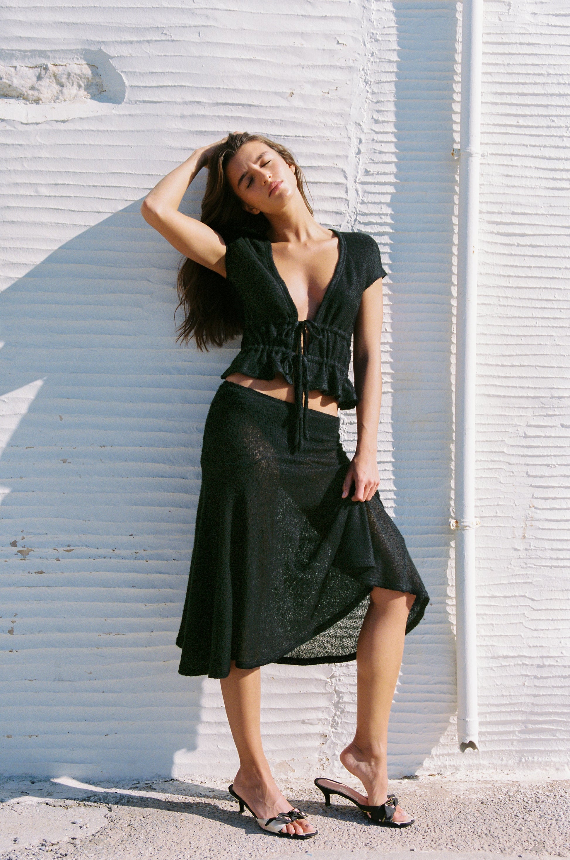 Image of a model wearing Skirts. Product name - Francis Skirt in Black colour by brand - With Jéan