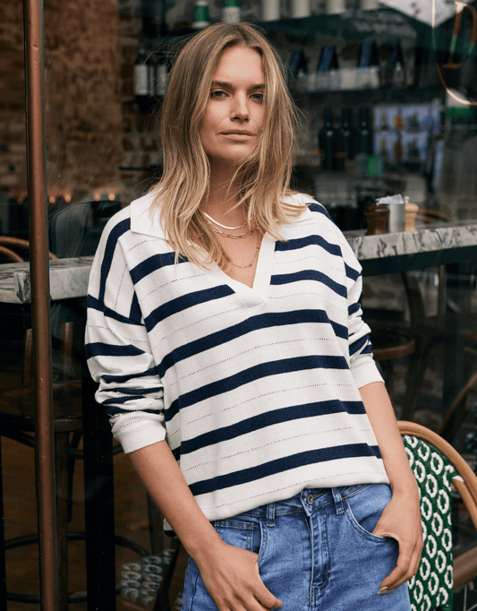Image of a model wearing Outerwear. Product name - Polo Frenchie Knit Ecru/Navy in Ecru/Navy colour by brand - White & Co.