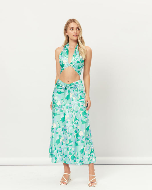 Image of a model wearing Pants. Productname: HEYCHIC Gracelyn Out Halter Crop Top And Skirt Set in Cut colour by brand - HEYCHIC