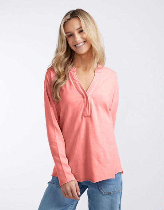 Image of a model wearing Tops. Productname: Henley Sunset Top - in Melon colour by brand - White & Co.