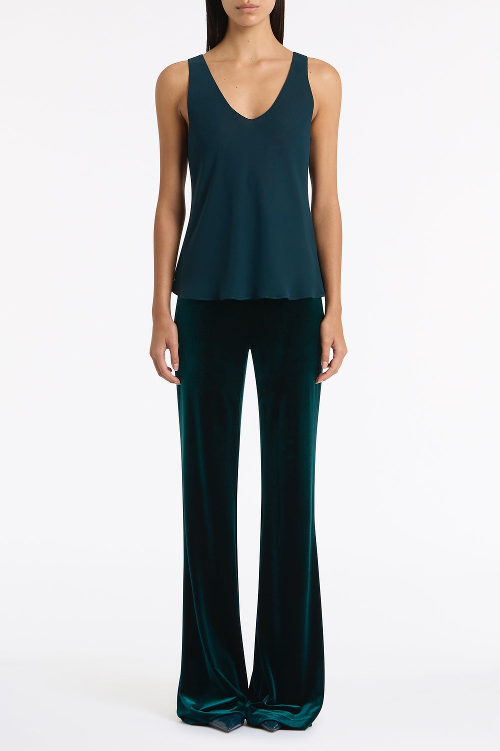 Image of a model wearing Tops. Product name - Hunter Green Georgette Scoop Cami in Green colour by brand - Carla Zampatti