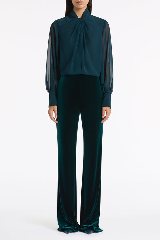 Image of a model wearing Tops. Product name - Hunter Green Georgette Twist Neck Top in Green colour by brand - Carla Zampatti