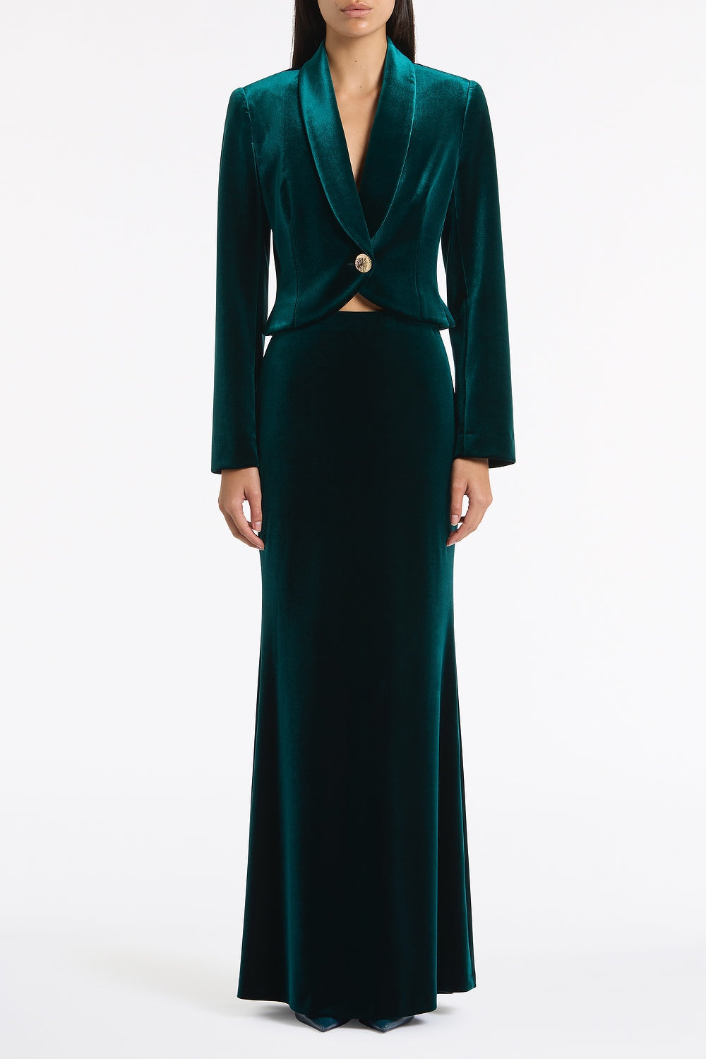 Image of a model wearing Skirts. Product name - Hunter Green Velvet Column Skirt in Green colour by brand - Carla Zampatti