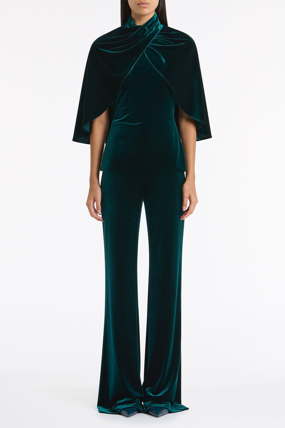 Image of a model wearing Tops. Product name - Hunter Green Velvet Wrap Neck Top in Green colour by brand - Carla Zampatti