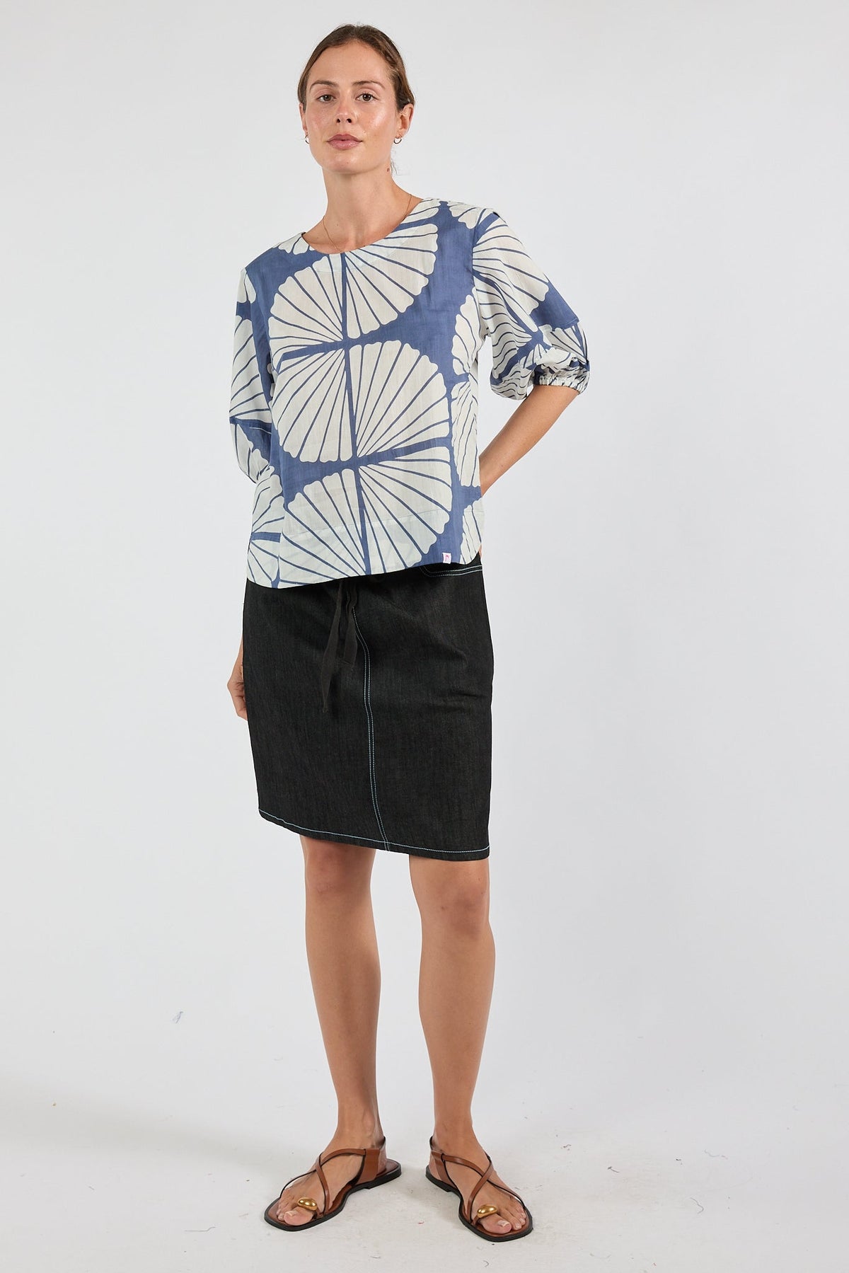 Image of a model wearing Tops. Product name - PRE SALE | IBSA Kayce Top Navy in Navy colour by brand - I.B.S.A