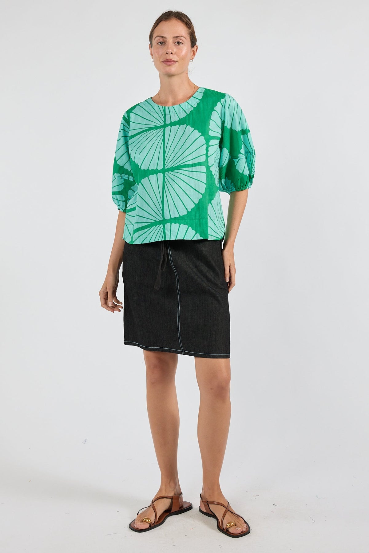 Image of a model wearing Tops. Product name - PRE SALE | IBSA Kayce Top Sea in Sea colour by brand - I.B.S.A