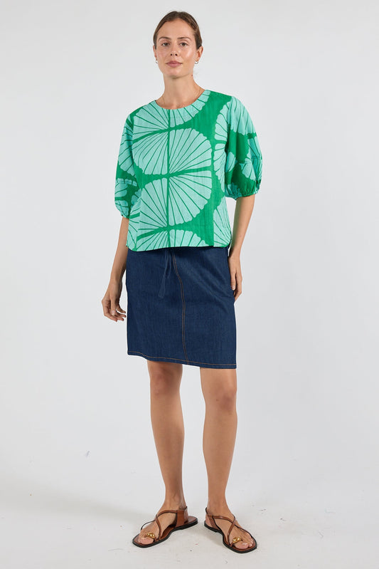 Image of a model wearing Tops. Product name - PRE SALE | IBSA Kayce Top Sea in Sea colour by brand - I.B.S.A