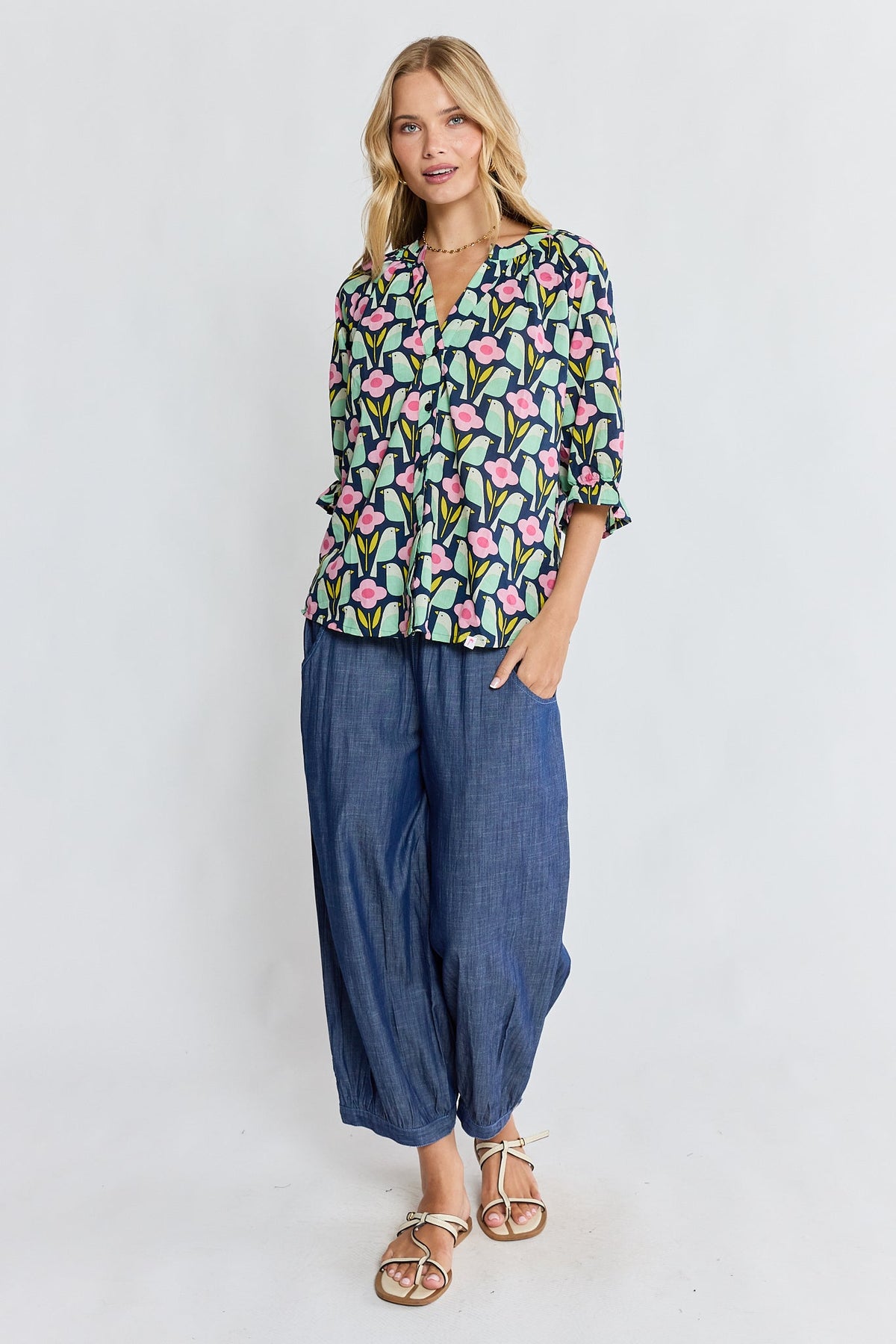 Image of a model wearing Tops. Product name - PRE SALE | IBSA Maya Top Navy in Navy colour by brand - I.B.S.A