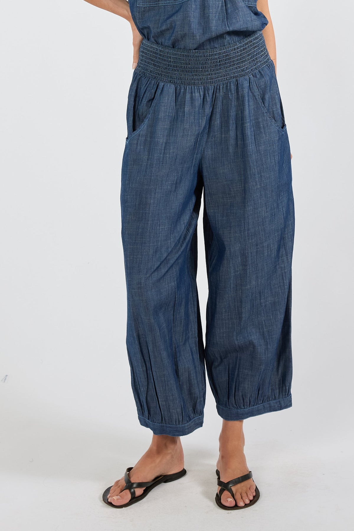 Image of a model wearing Pants. Product name - PRE SALE | IBSA Montana Balloon Pant Dark in Tan colour by brand - I.B.S.A