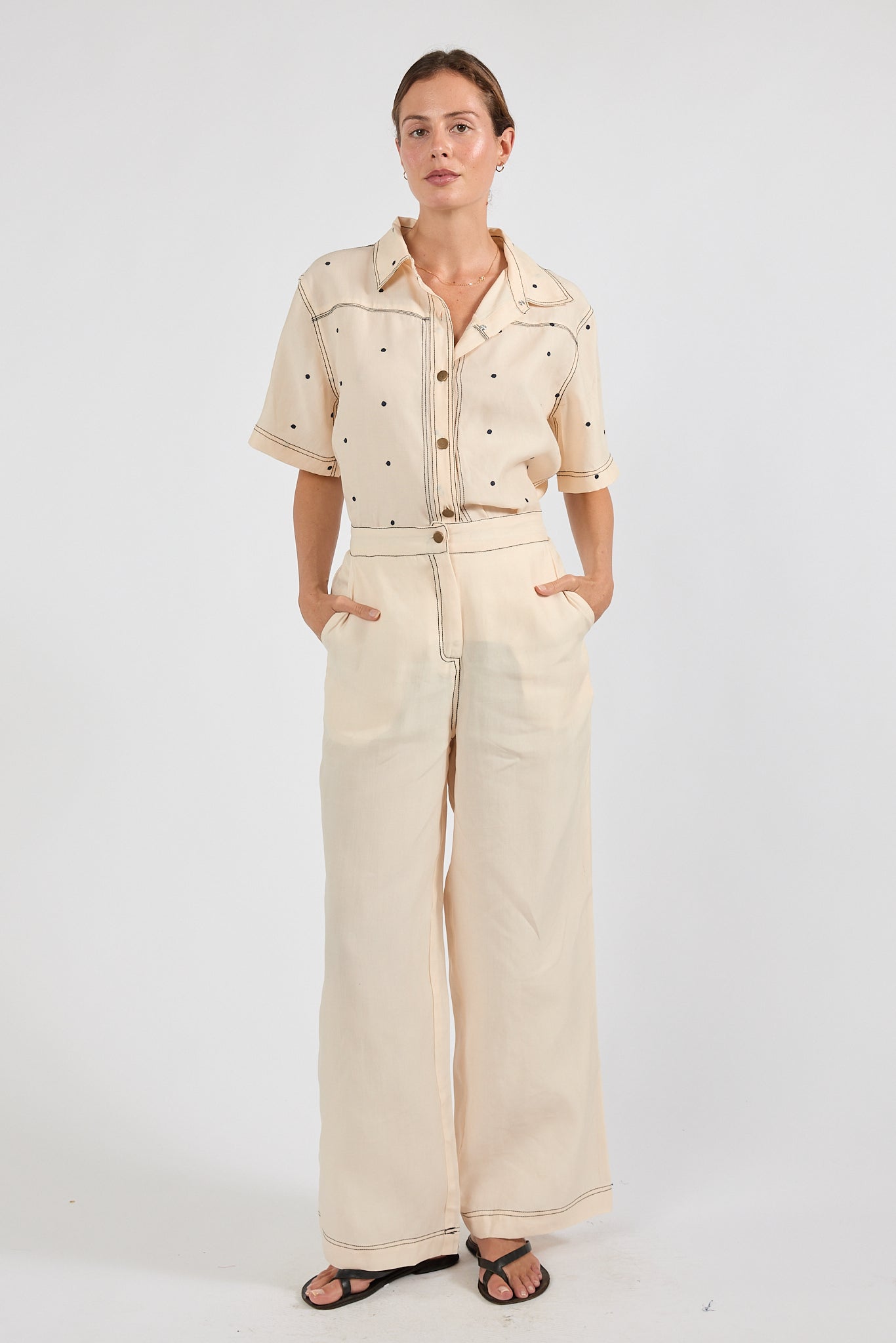 Image of a model wearing Pants. Product name - IBSA River Pant Cream in Cream colour by brand - I.B.S.A