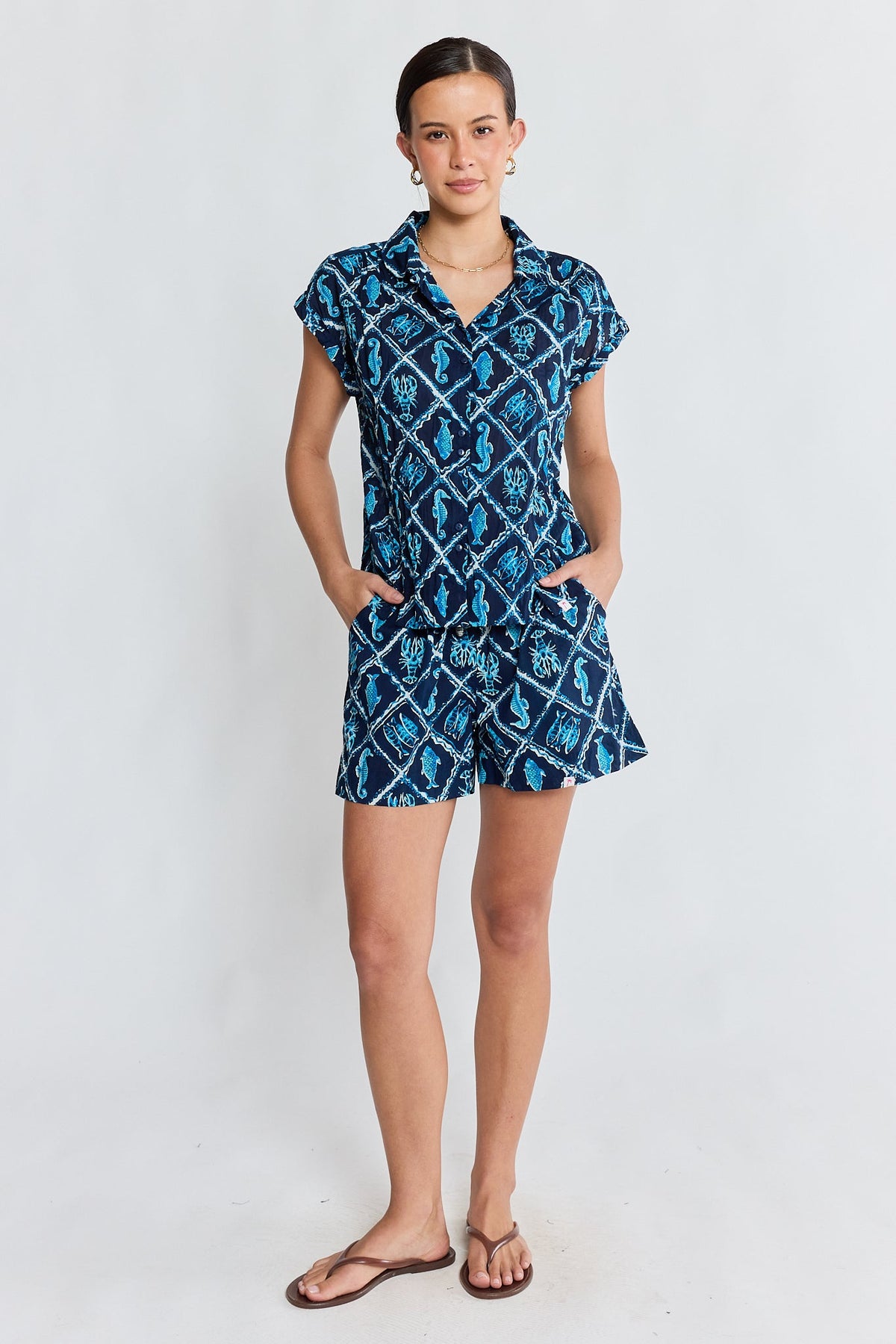 Image of a model wearing Tops. Product name - PRE SALE | IBSA Zeke Top Navy in Navy colour by brand - I.B.S.A
