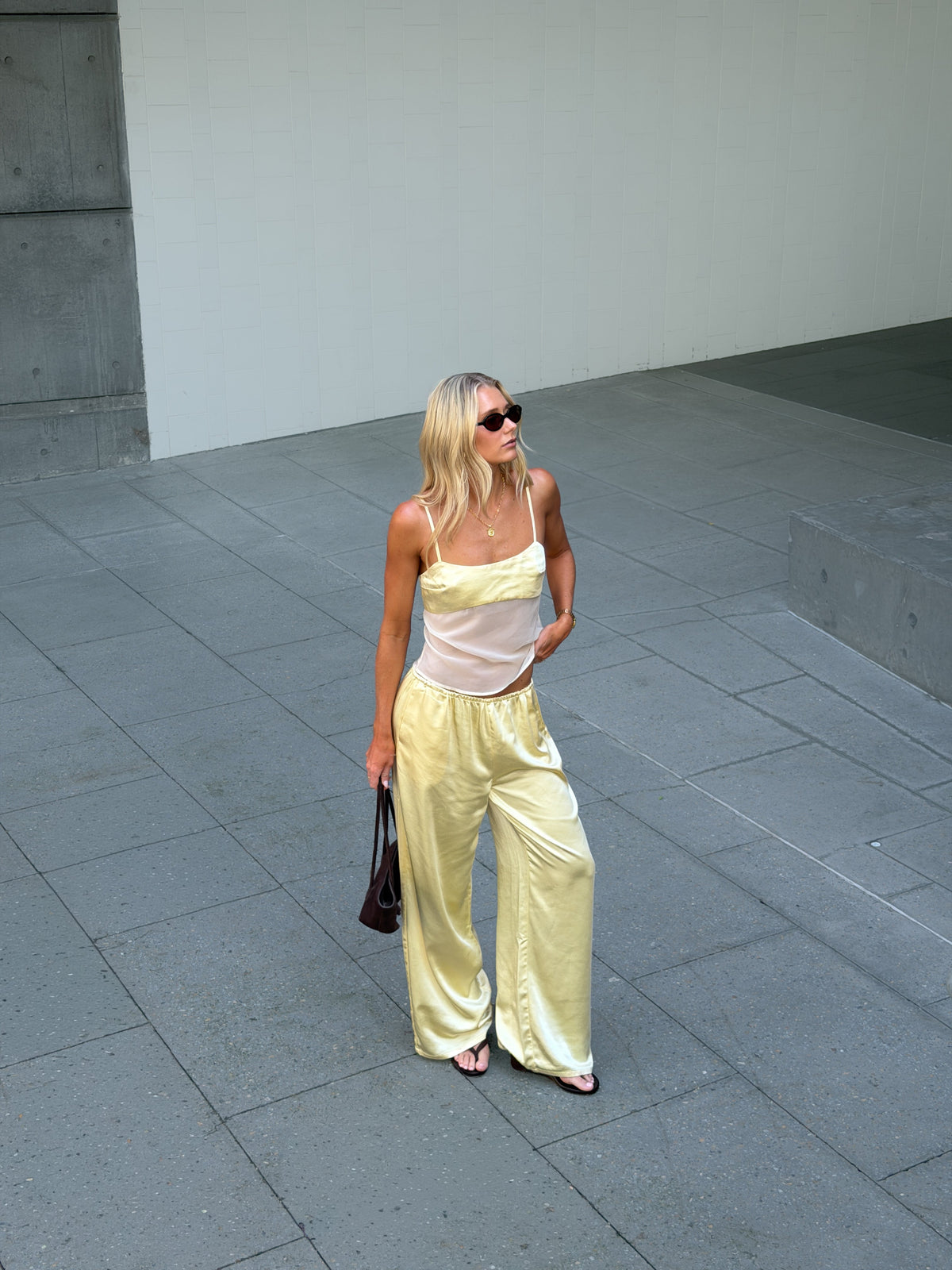 Image of a model wearing Pants. Productname: SNDYS ZOE PANTS in Butter colour by brand - SNDYS