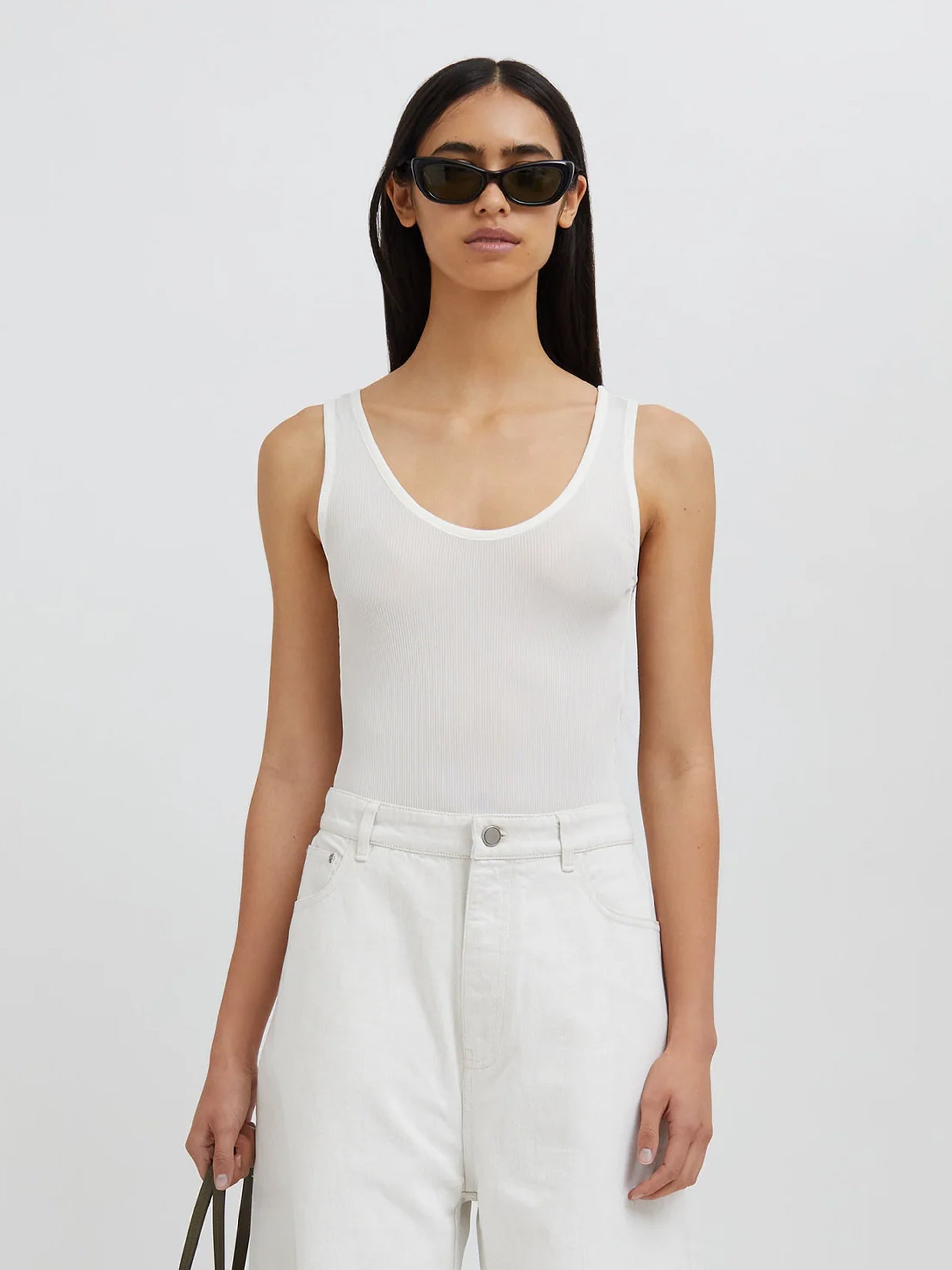 Image of a model wearing Tops. Productname: Christopher Esber Sonora Tank Bodysuit in White colour by brand - Christopher Esber