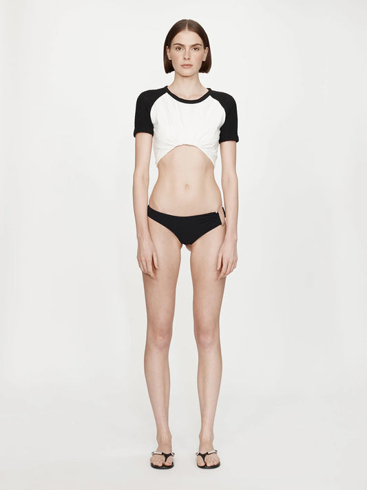 Image of a model wearing Tops. Product name - Tucked Ringer Jersey Tee in White colour by brand - CHRISTOPHER ESBER