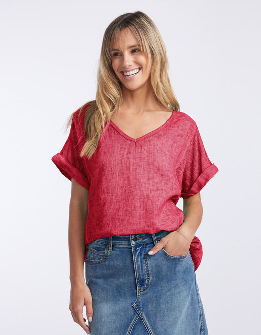 Image of a model wearing Tops. Product name - Calypso Linen Short Sleeve Top India Rust in India Rust colour by brand - Love From Italy