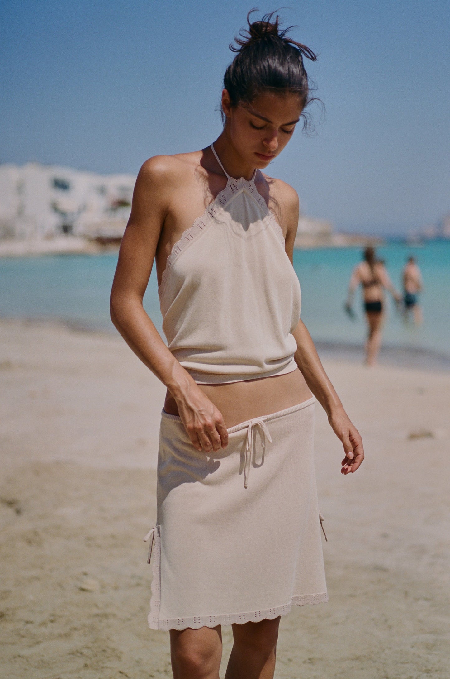 Image of a model wearing Skirts. Product name - Isla Skirt in Beige colour by brand - With Jéan