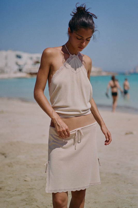 Image of a model wearing Skirts. Product name - Isla Skirt in Beige colour by brand - With Jéan