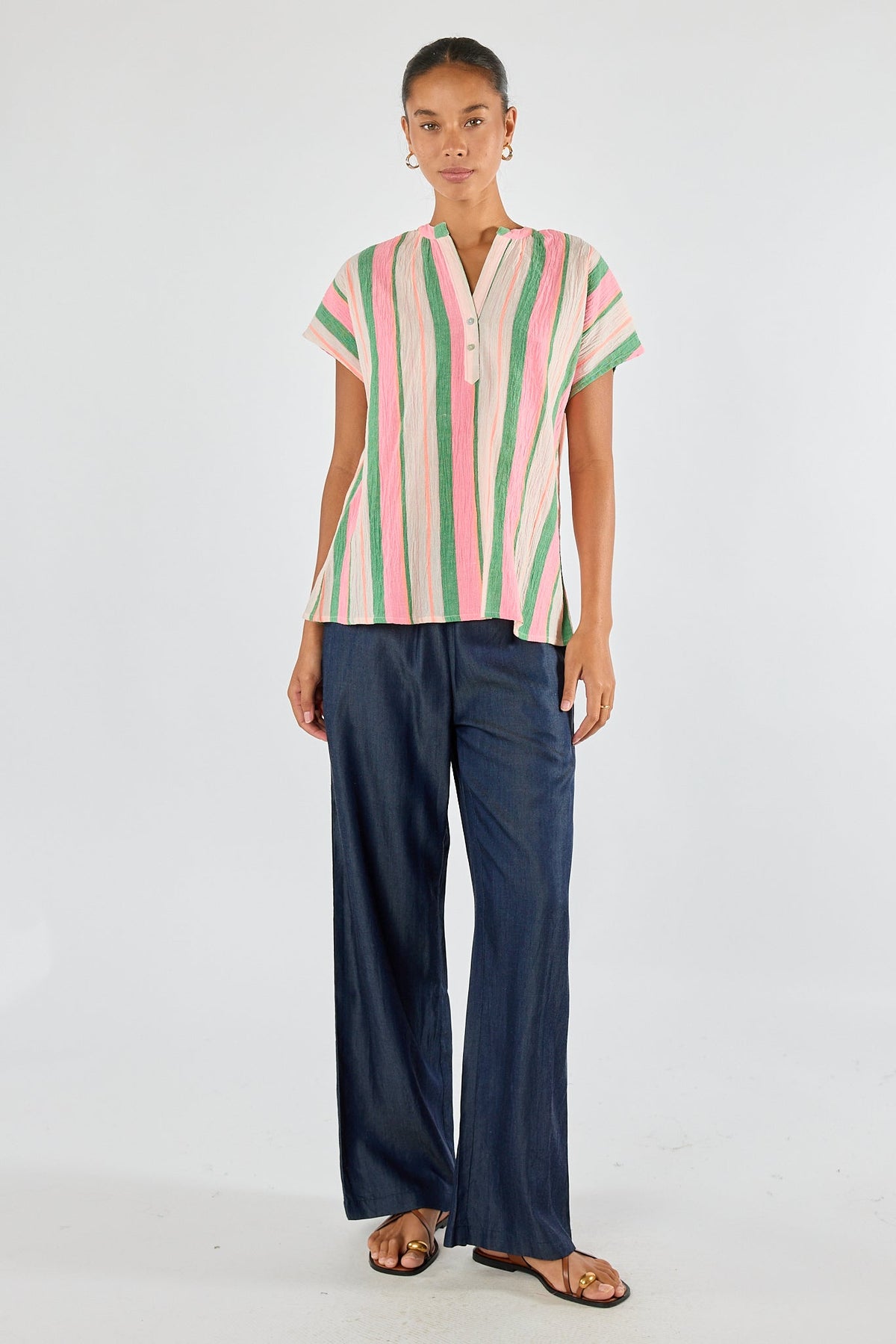 Image of a model wearing Tops. Product name - Itami Basque Top Green in Green colour by brand - Itami Division