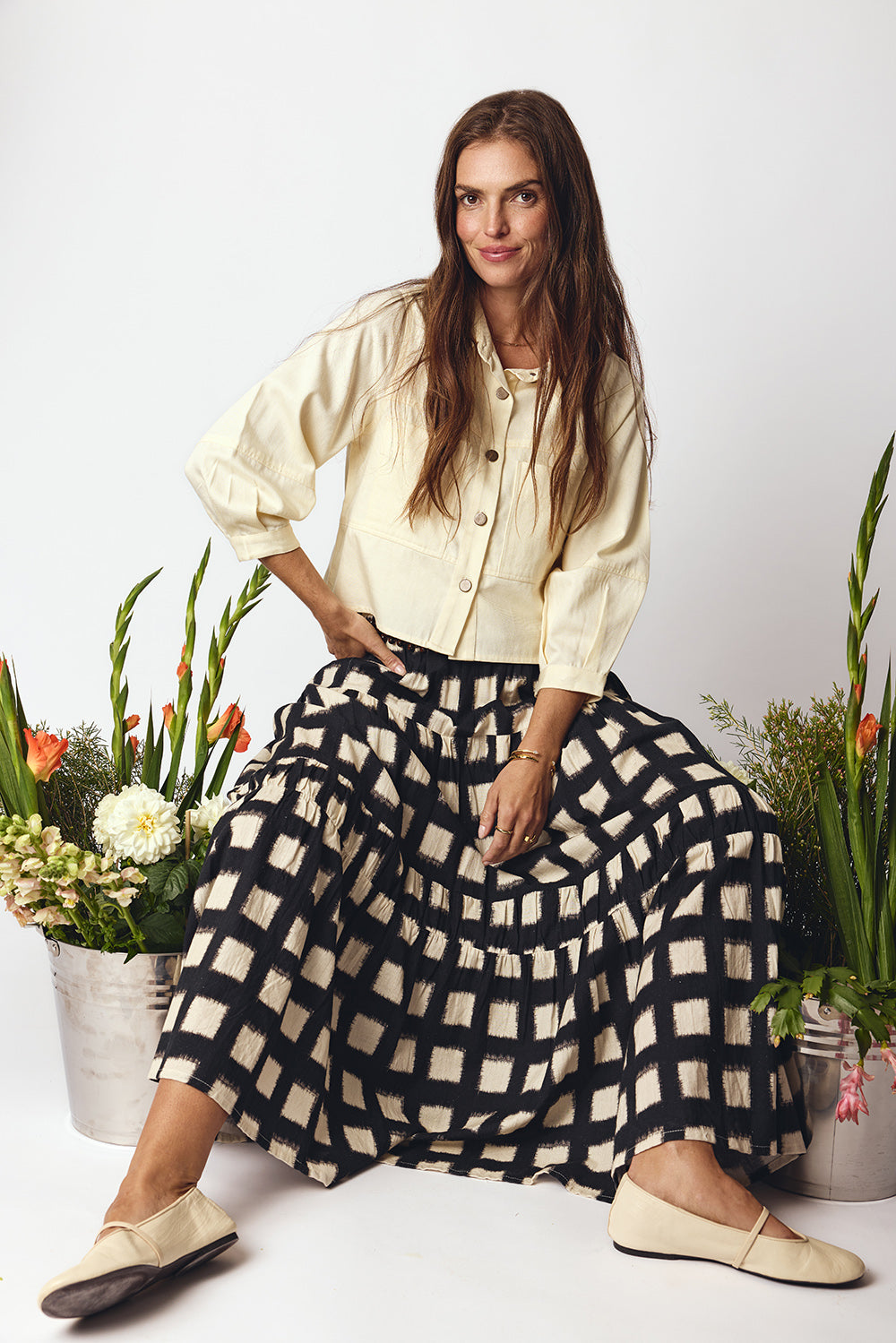 Image of a model wearing Skirts. Product name - Itami Bloc Skirt Black in Black colour by brand - Itami Division