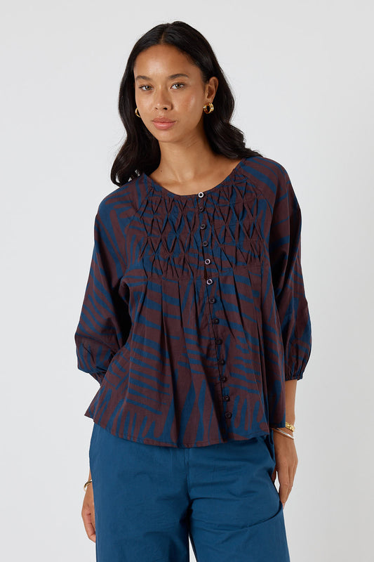 Image of a model wearing Tops. Product name - Itami Borges Top Brown in Brown colour by brand - Itami Division