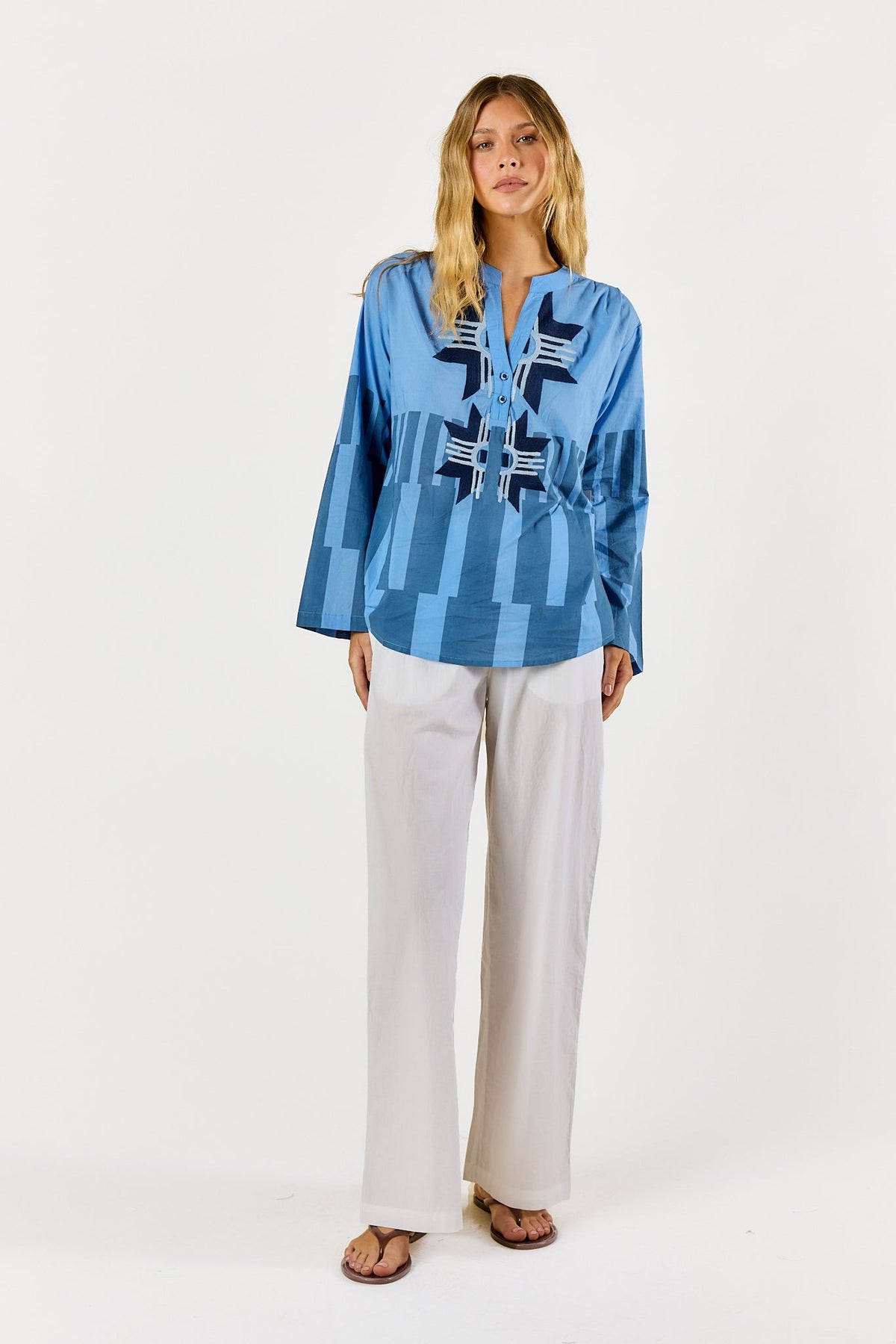 Image of a model wearing Tops. Product name - Itami Cension Top Blue in Blue colour by brand - Itami Division
