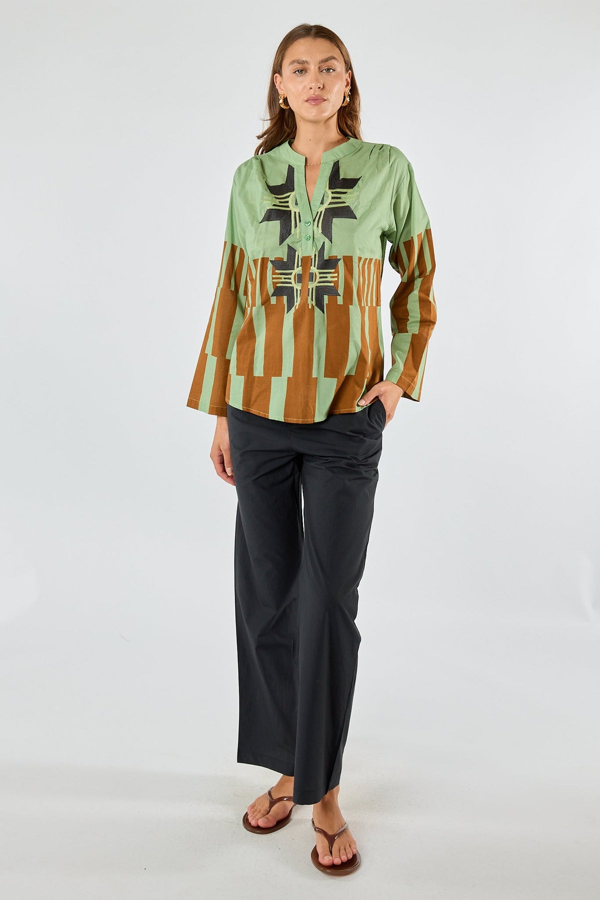 Image of a model wearing Tops. Product name - Itami Cension Top Khaki in Khaki colour by brand - Itami Division