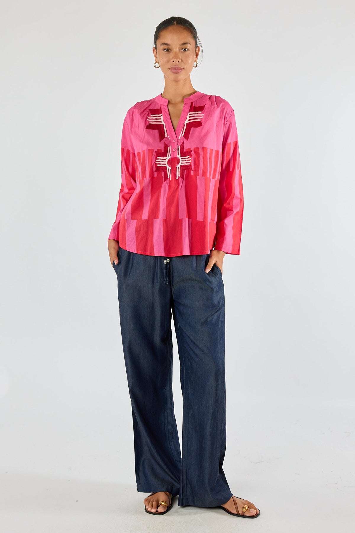 Image of a model wearing Tops. Product name - Itami Cension Top Pink in Pink colour by brand - Itami Division