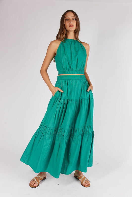 Image of a model wearing Tops. Productname: Itami Eden Halter Emerald in Emerald colour by brand - Itami Division