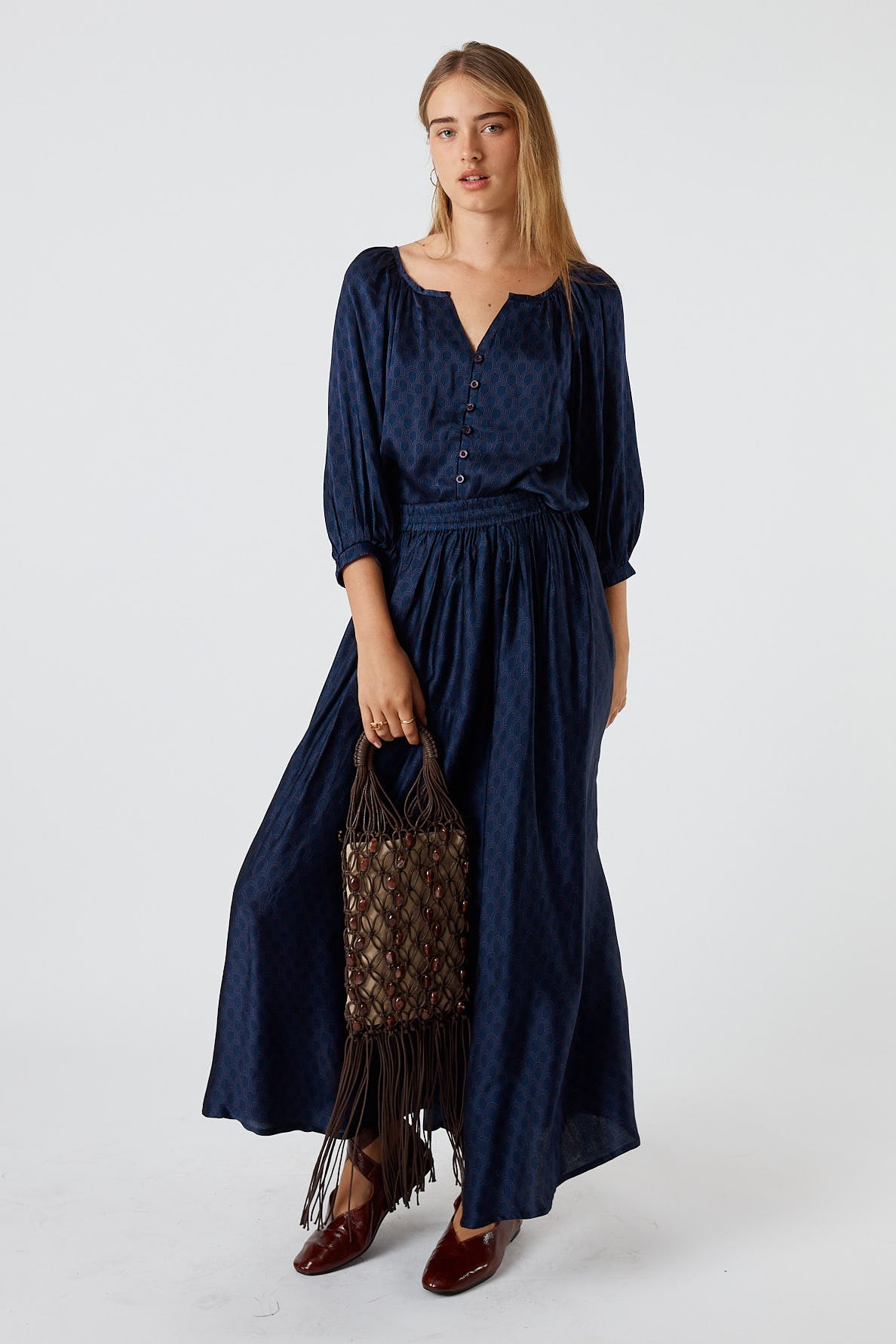 Image of a model wearing Skirts. Product name - Itami Emilie Skirt Blue in Blue colour by brand - Itami Division