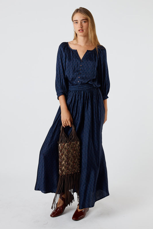 Image of a model wearing Skirts. Product name - Itami Emilie Skirt Blue in Blue colour by brand - Itami Division