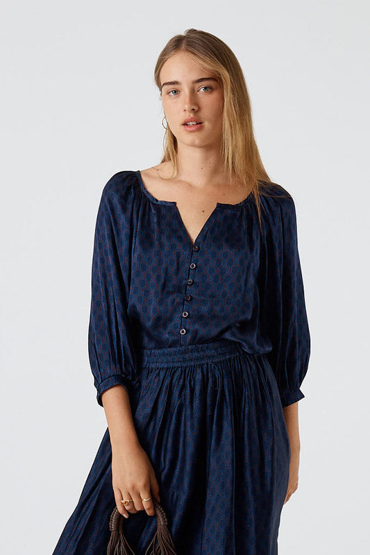 Image of a model wearing Tops. Product name - Itami Emilie Top Blue in Blue colour by brand - Itami Division