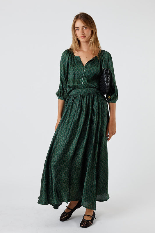 Image of a model wearing Skirts. Product name - Itami Emilie Skirt Green in Green colour by brand - Itami Division