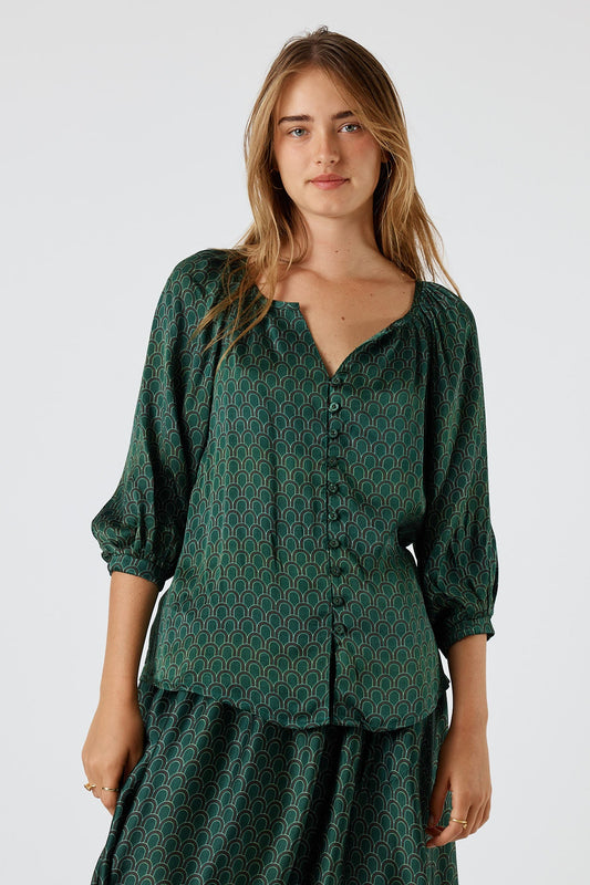 Image of a model wearing Tops. Product name - Itami Emilie Top Green in Green colour by brand - Itami Division