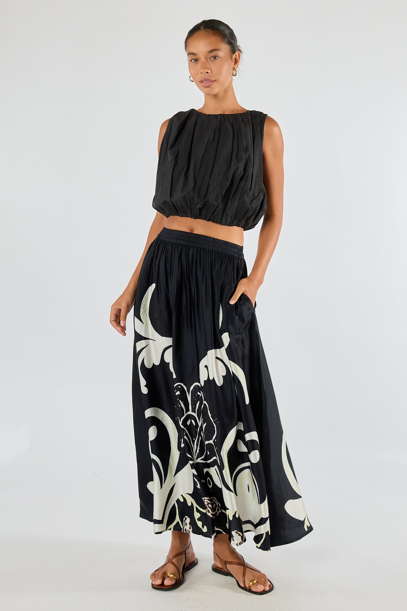 Image of a model wearing Skirts. Product name - Itami Fontes Skirt White in White colour by brand - Itami Division