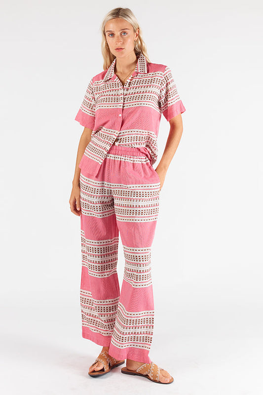 Image of a model wearing Pants. Productname: Itami Licorice Pant in Pant colour by brand - Itami Division