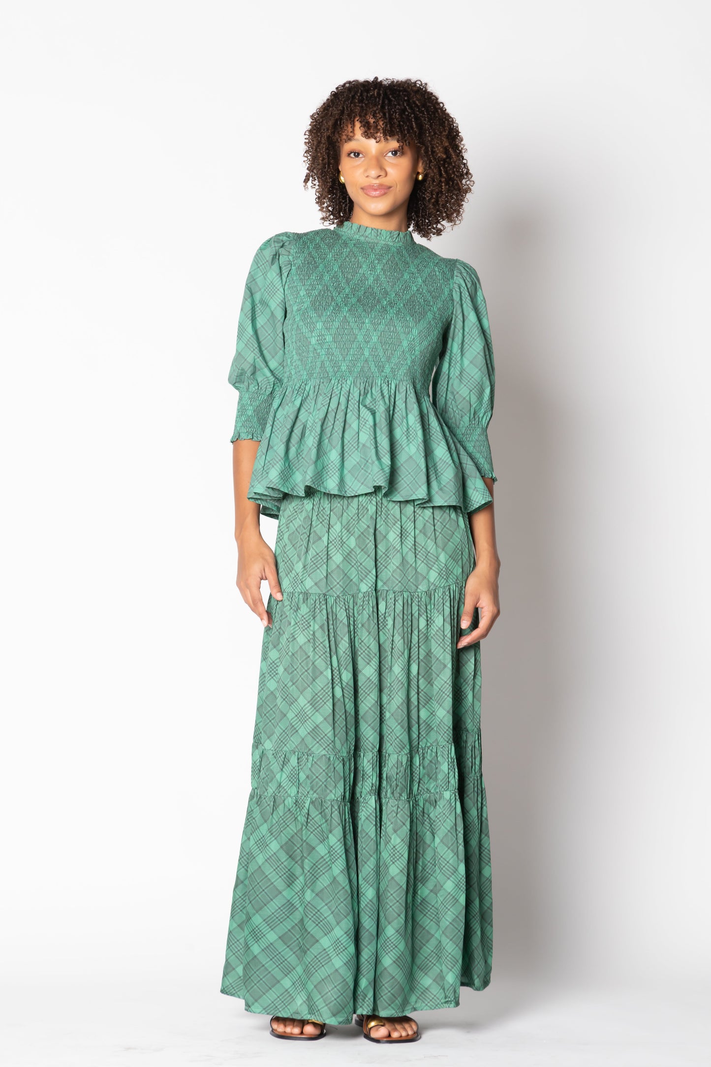 Image of a model wearing Skirts. Productname: Itami Eden Skirt Tartan Green in Green colour by brand - Itami Division