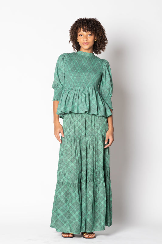 Image of a model wearing Skirts. Productname: Itami Eden Skirt Tartan Green in Green colour by brand - Itami Division