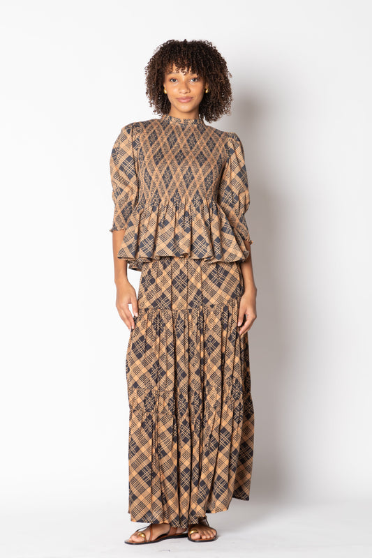 Image of a model wearing Skirts. Productname: Itami Eden Skirt Tartan Latte in Tan colour by brand - Itami Division