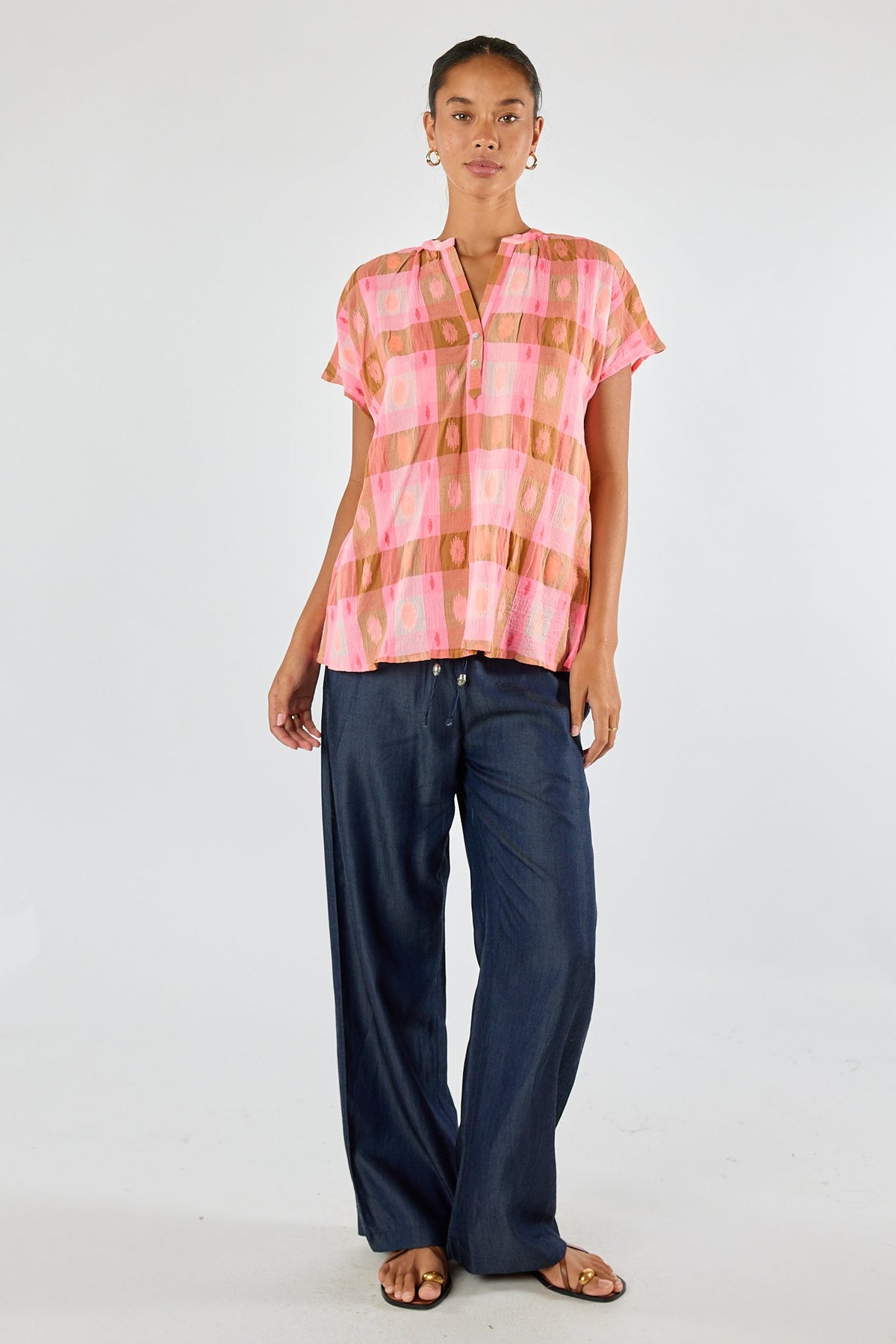 Image of a model wearing Tops. Product name - Itami Navarro Top in Top colour by brand - Itami Division