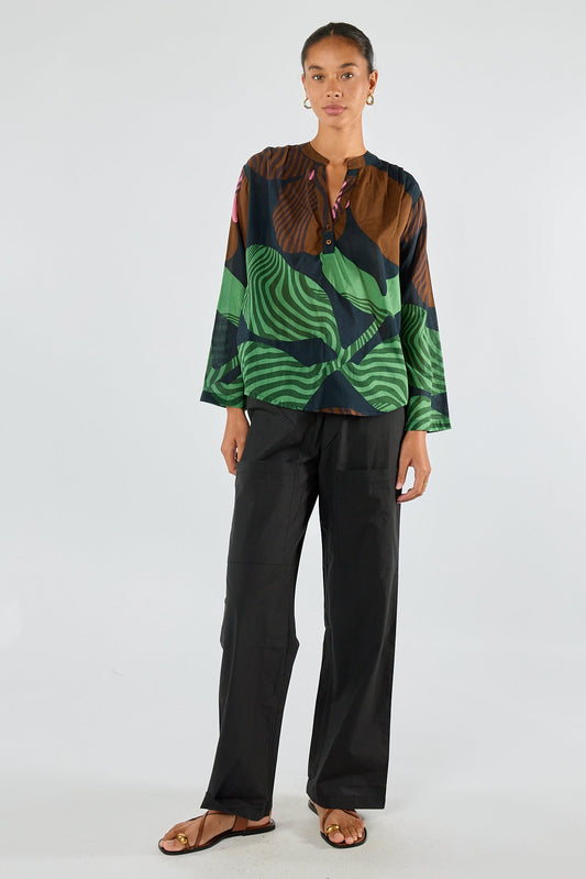 Image of a model wearing Tops. Product name - Itami Papillon LS Top Black in Black colour by brand - Itami Division