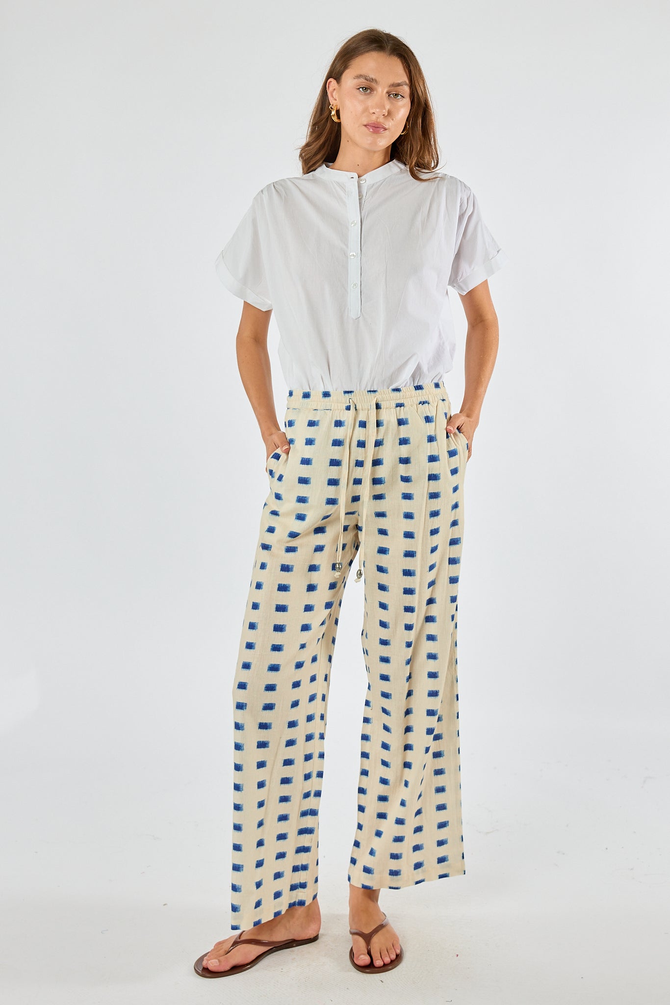 Image of a model wearing Pants. Product name - Itami Rocha Pant Natural in Natural colour by brand - Itami Division