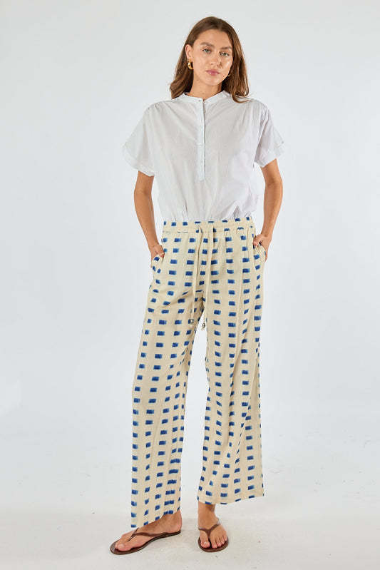 Image of a model wearing Pants. Product name - Itami Rocha Pant Natural in Natural colour by brand - Itami Division