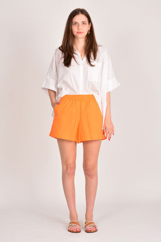 Image of a model wearing Shorts. Productname: Itami Short Orange in Orange colour by brand - Itami Division