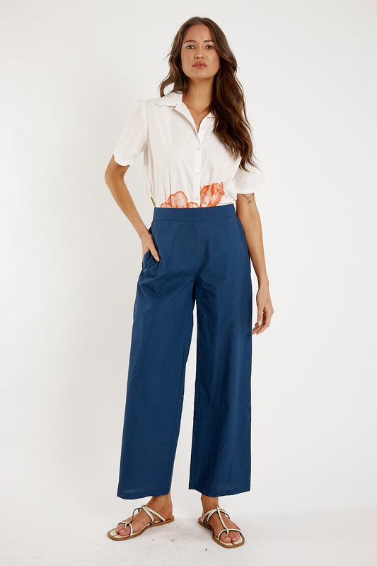 Image of a model wearing Pants. Productname: Itami Staple Pant Navy in Navy colour by brand - Itami Division