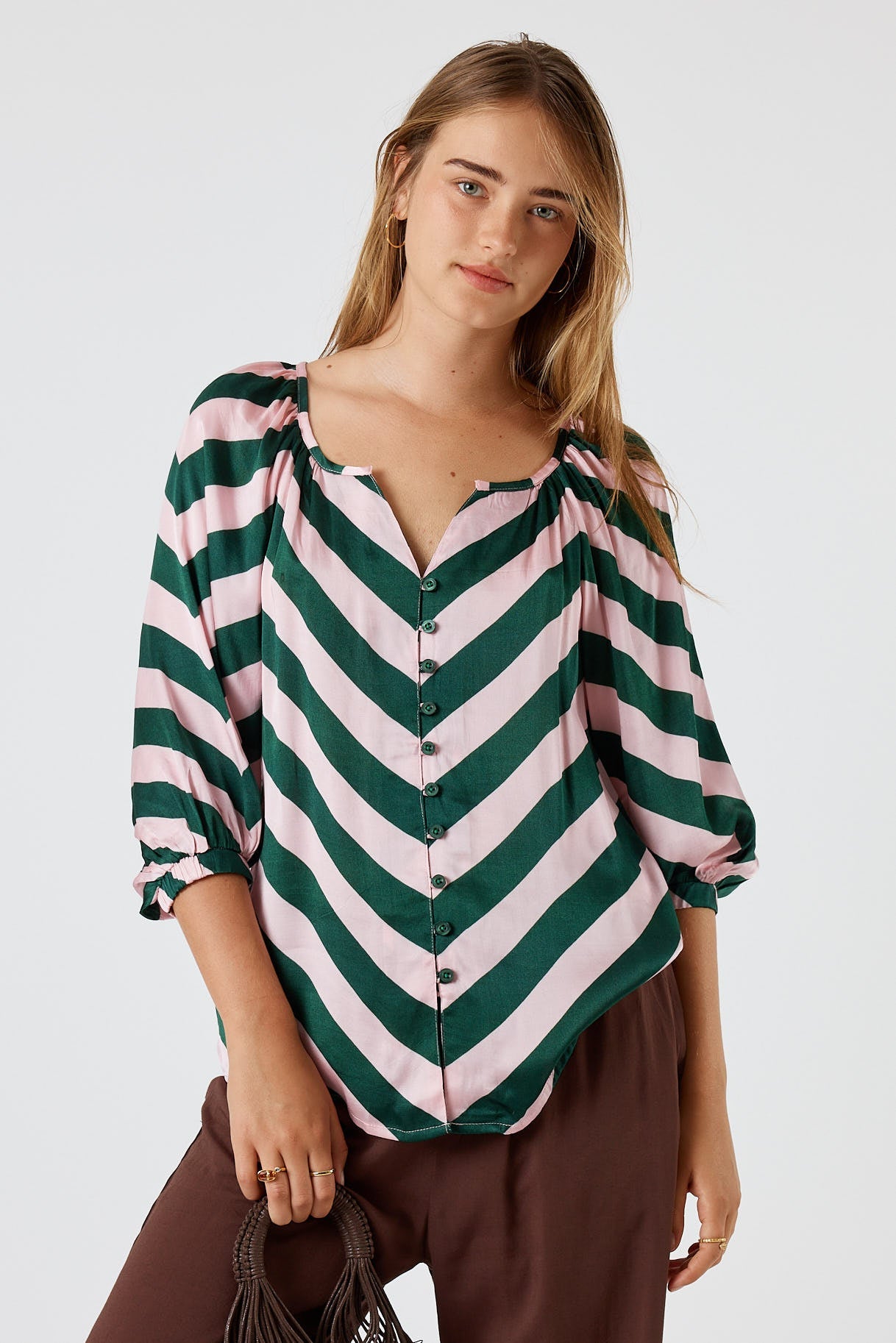 Image of a model wearing Tops. Product name - Itami Stripe Button Top Olive in Olive colour by brand - Itami Division