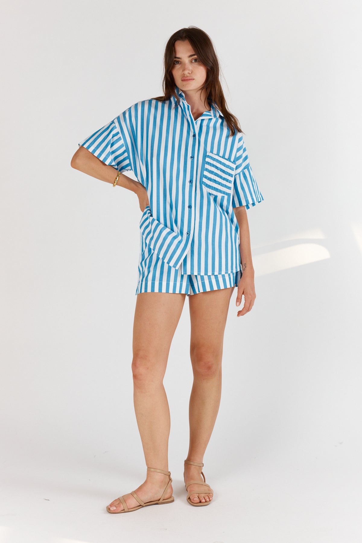 Image of a model wearing Shorts. Productname: Itami Stripe Short Blue in Blue colour by brand - Itami Division