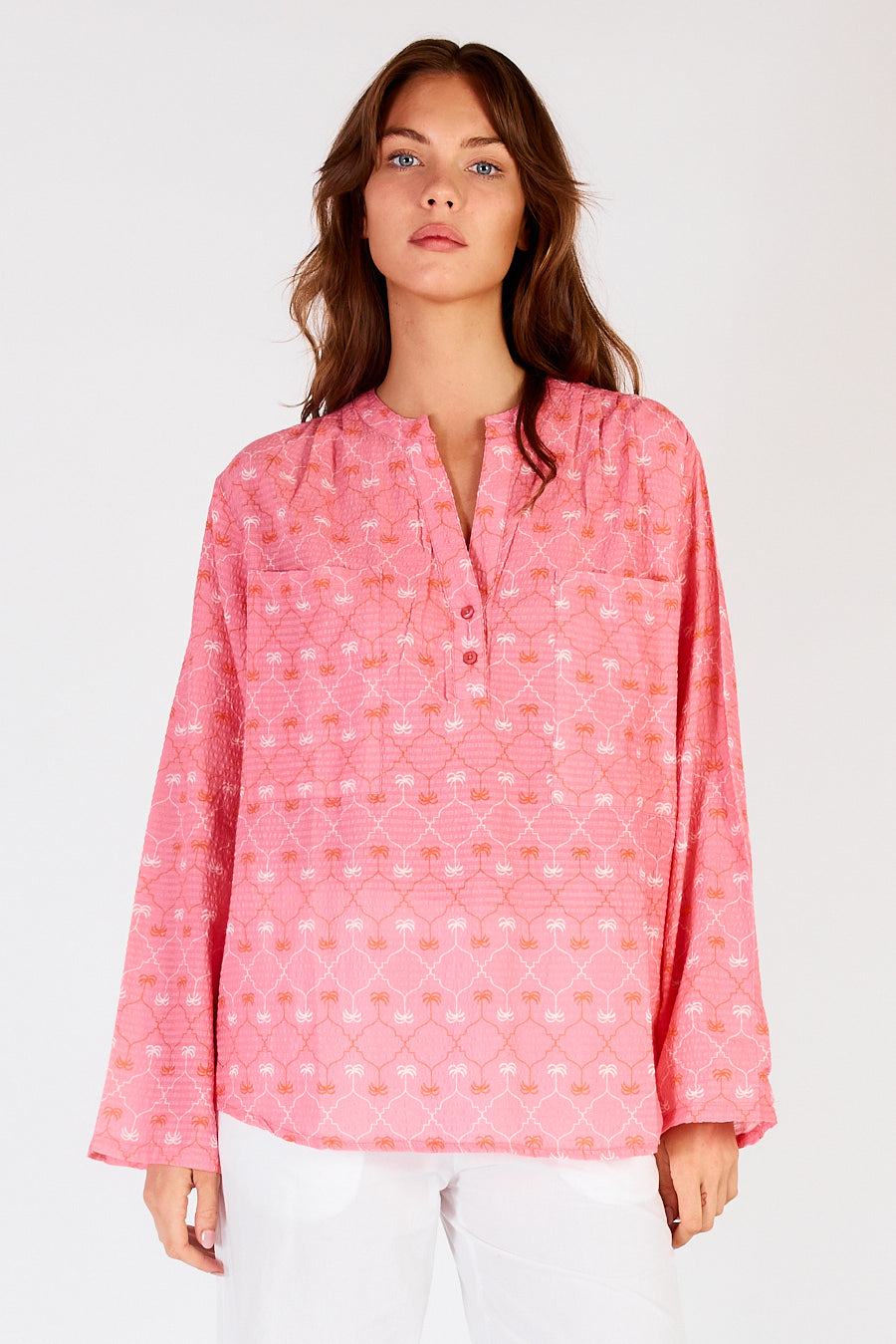 Image of a model wearing Tops. Productname: Itami Tiki Top Almera Pink in Pink colour by brand - Itami Division