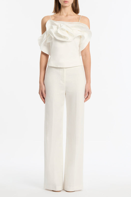 Image of a model wearing Tops. Product name - Ivory Cotton Taffeta Flower Top in Ivory colour by brand - Carla Zampatti