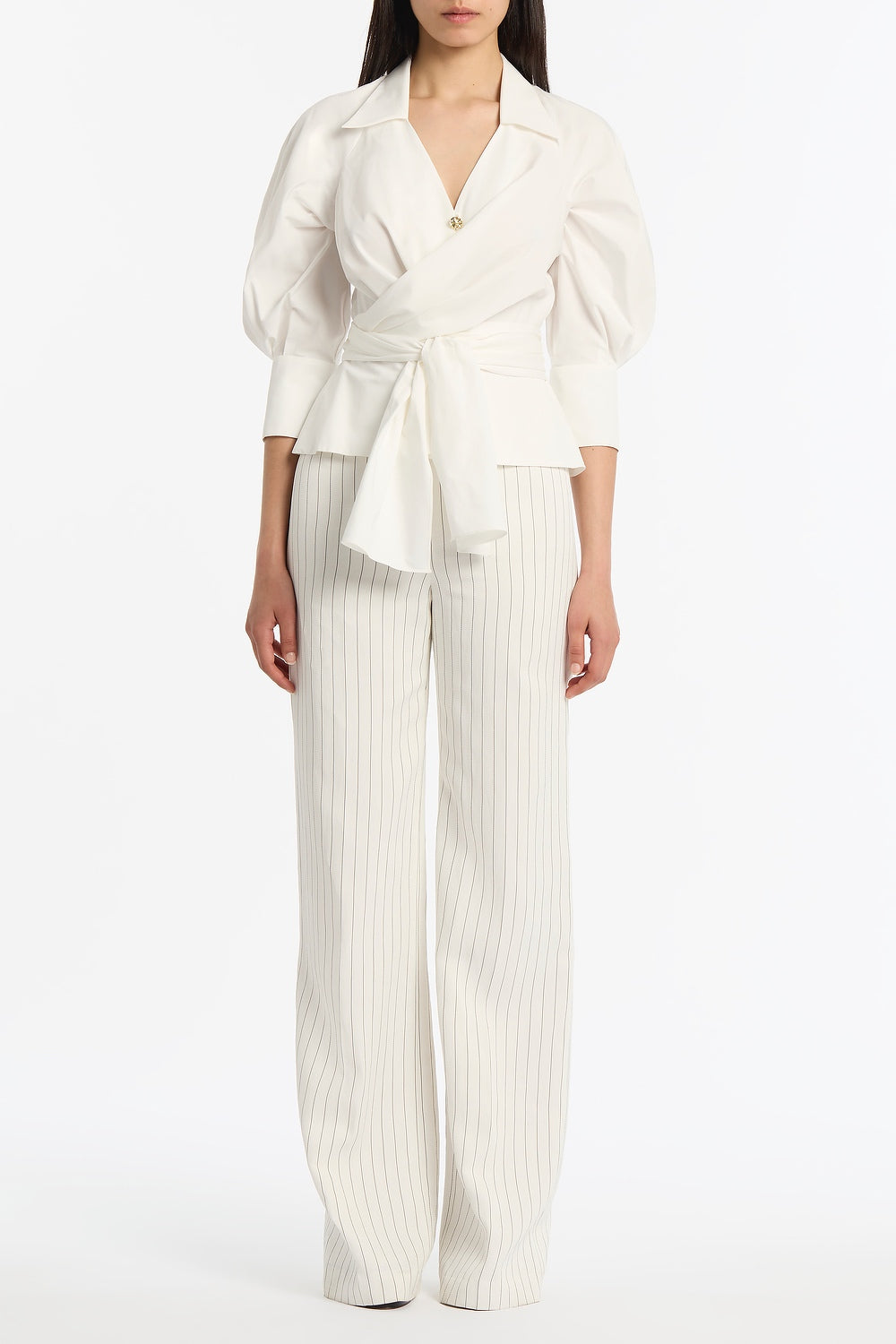 Image of a model wearing Tops. Product name - Ivory Cotton Taffeta Wrap Top in Ivory colour by brand - Carla Zampatti